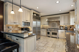 Luxurty kitchen with earth tone colors and flawlessly painted off-white shaker-style cabinets