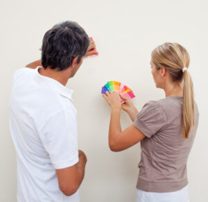 Interior House Painters Texas Couple choosing a color to paint a room after move in